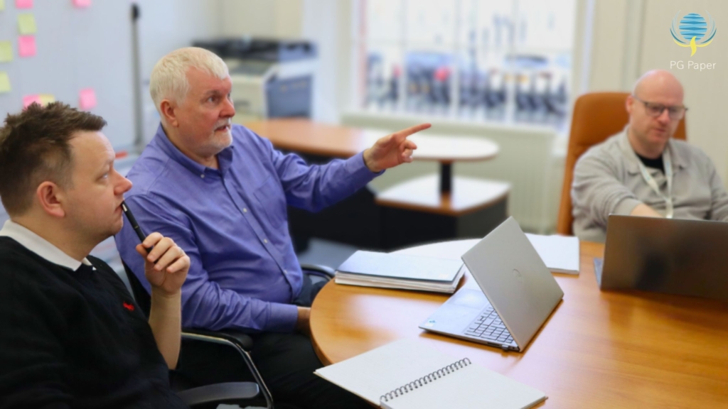 PG Paper UK Sales Team discussing in a meeting in the small boardroom.