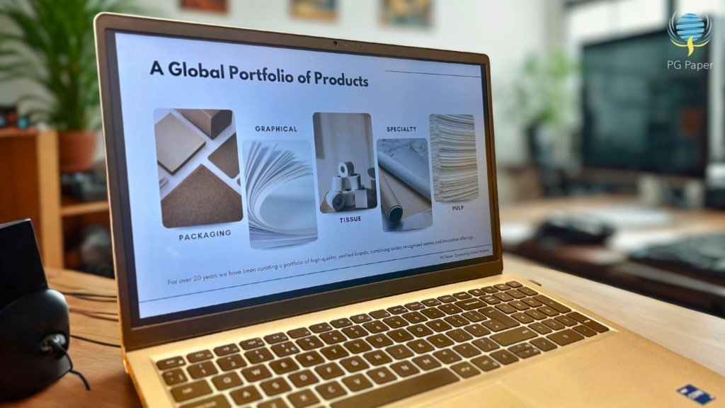 A laptop displaying PG Paper's global portfolio of products including packaging, graphical, tissue, specialty and pulp.